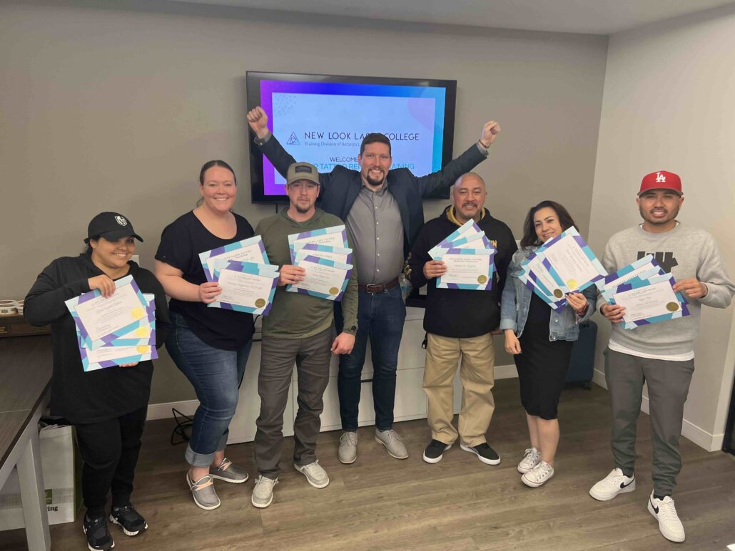 new look laser college students pose with their certificates after completing the laser tattoo removal training course in Las Vegas